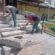 Працівники ПП “Східний масив” ремонтують сходи на проспекті Степана Бандери, 74