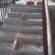 Працівники ПП “Східний масив” ремонтують сходи на проспекті Степана Бандери, 20